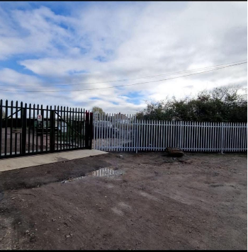 Secure fenced yard entrance at Pegasus Warley.